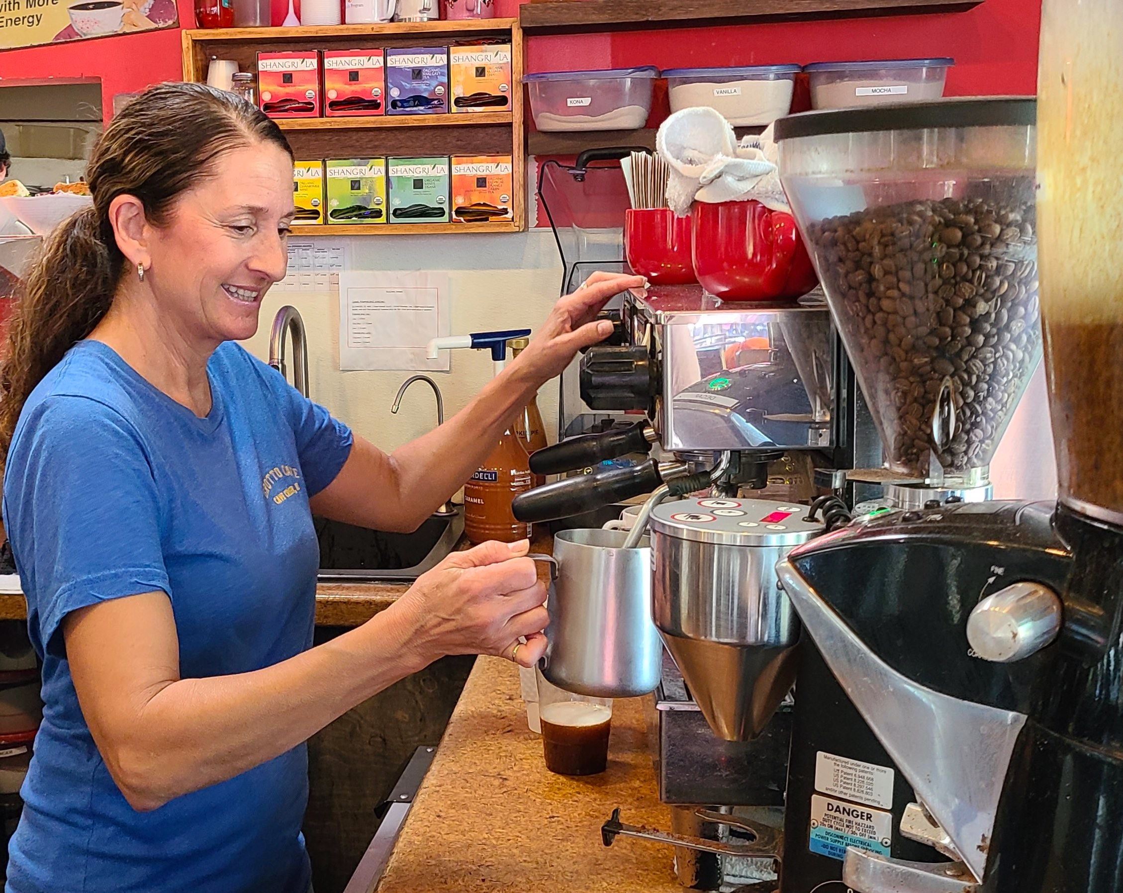 Woman making an espresso 